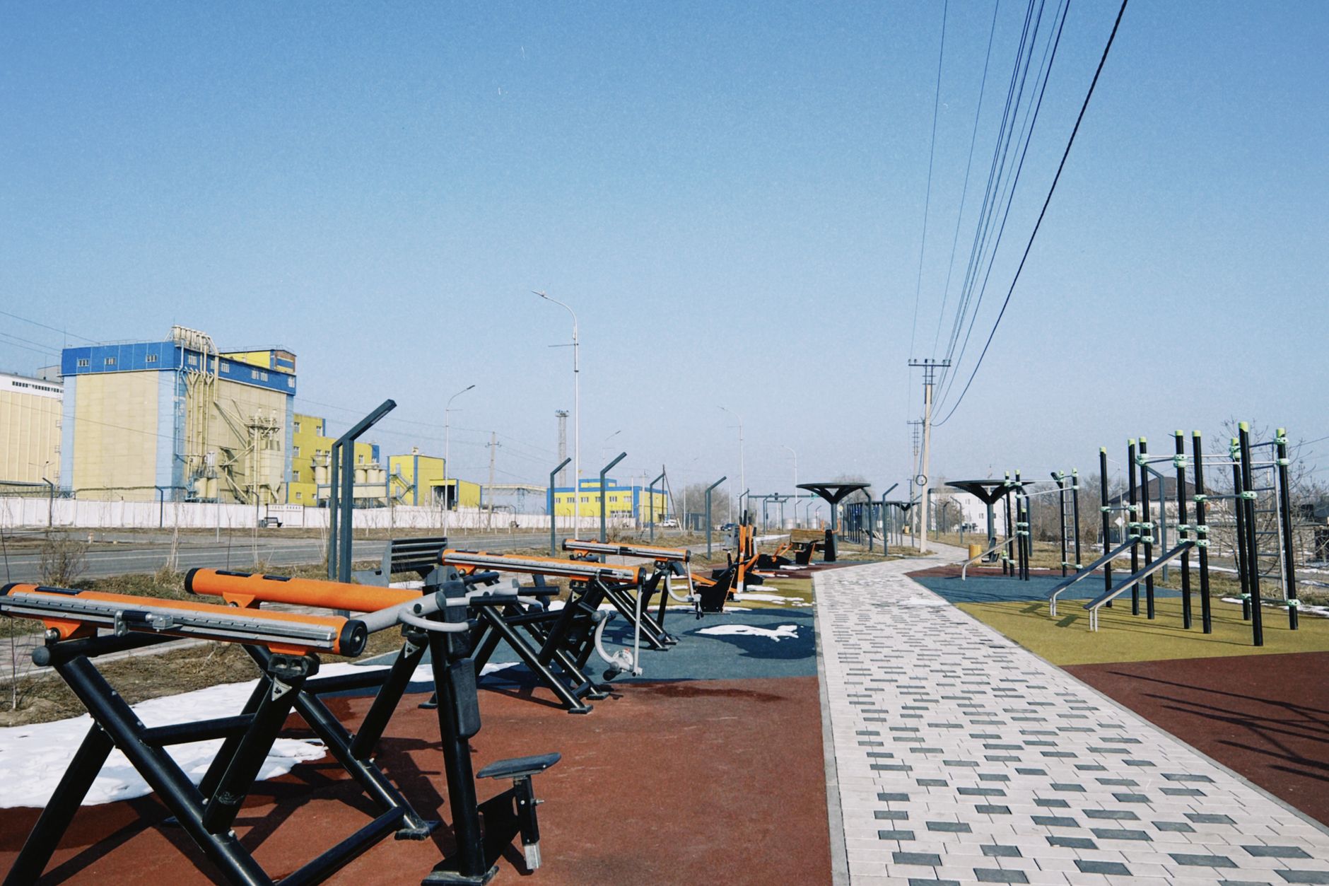 Outdoor conditioning stations beside a paved path